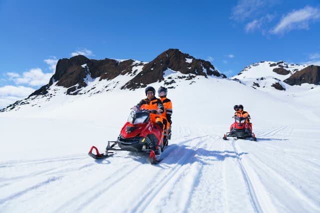 happy-tourists-glacier-snowmobiling-langjokull